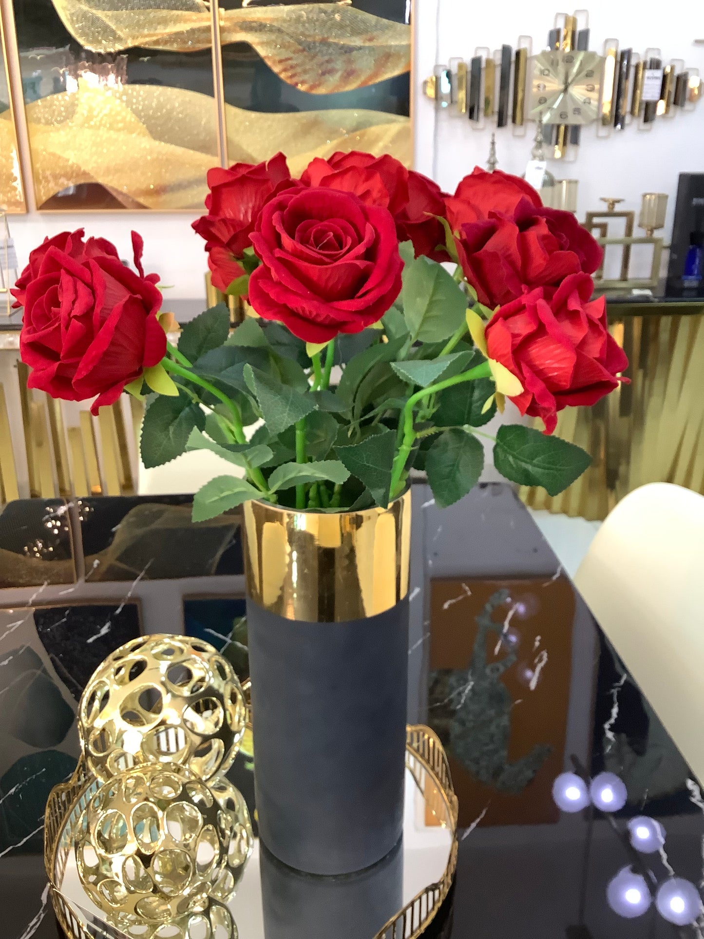 Black and gold vase with rose