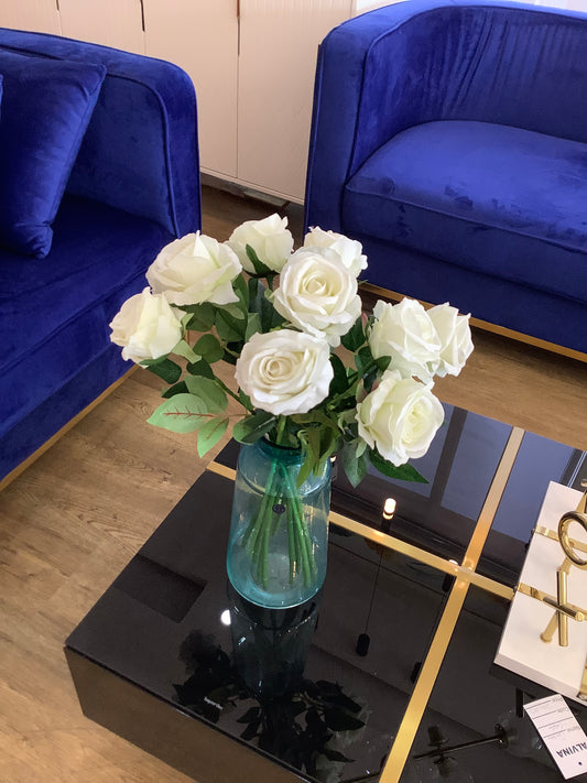 Glass vase and white roses