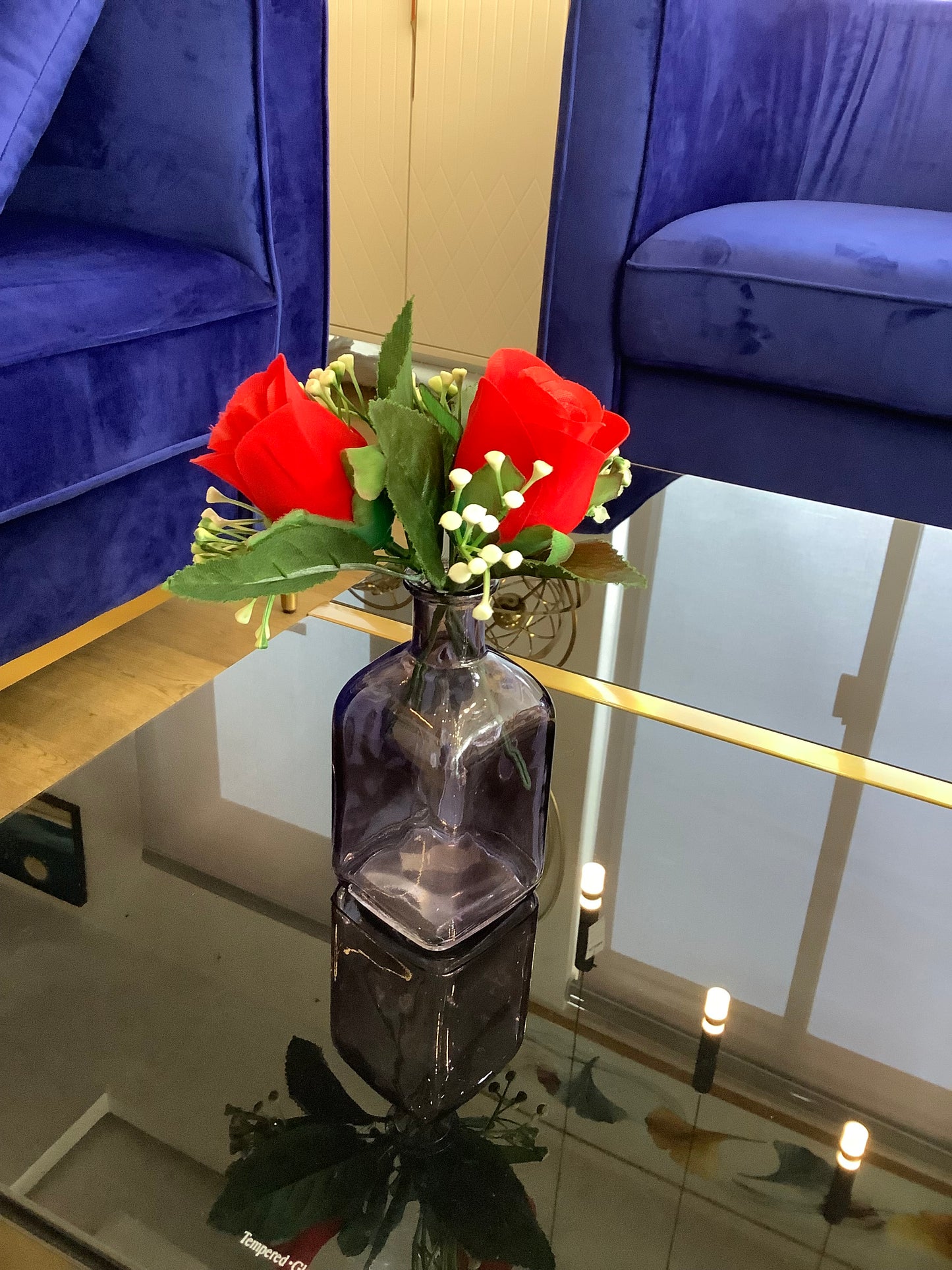 Bottle vase and rose